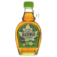 glass bottle of organic classic Canadian maple syrup. Green labelling and bottle cap