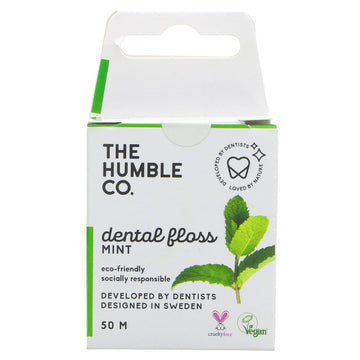 Pack of mint dental floss from the humble co. White box with green and black decoration