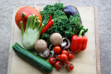 A series of photos showing a Small Mediterranean box. Contains approximately 5-7 types of veg, such as tomatoes, courgettes, aubergine, peppers, garlic….  