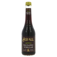 A glass bottle of balsamic vinegar with a metal lid