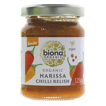 A glass jar of organic harissa chilli relish with a metal lid