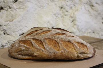 A loaf of white sourdough bread