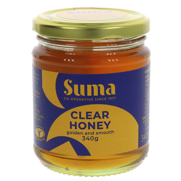 A glass jar of honey with a metal lid