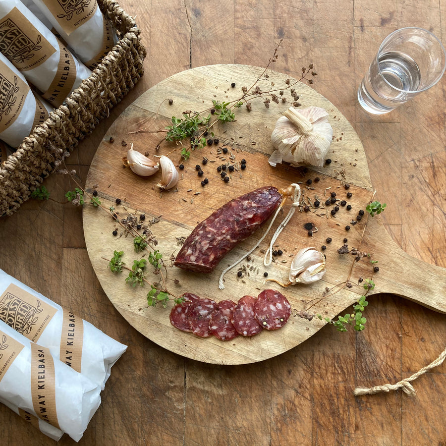 Sliced dried sausage on a chopping board