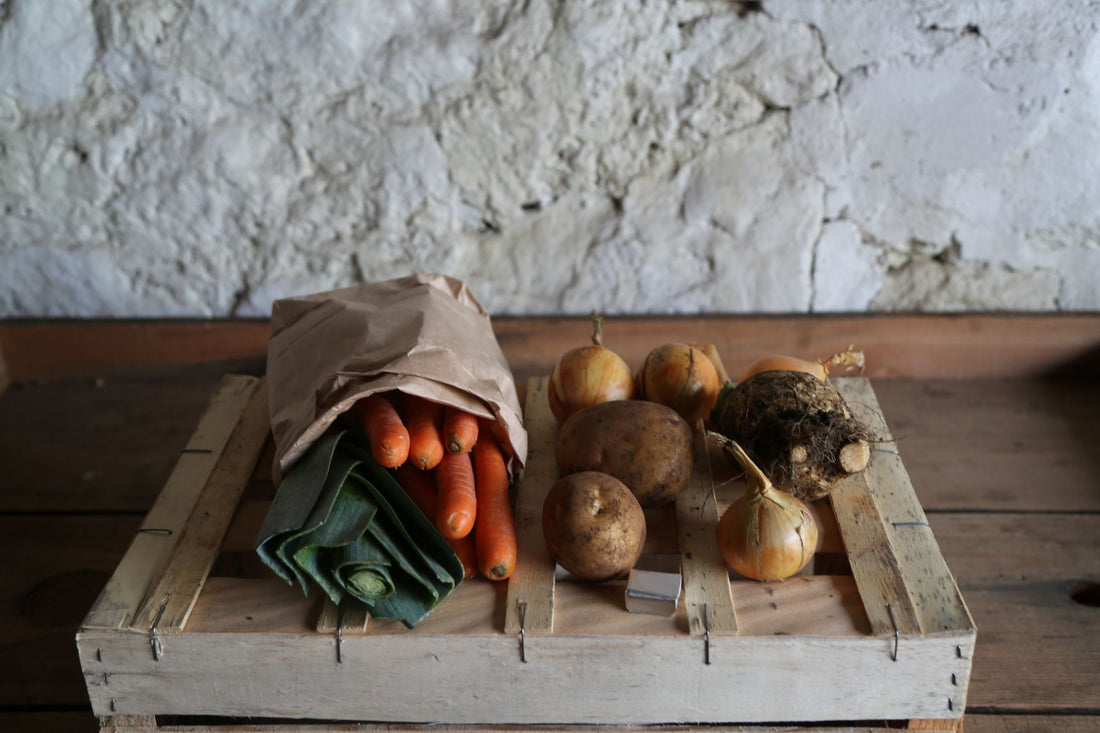 Photo shows a soup bag, including seasonal veg, and an organic stock cube to make a great pot of soup! Can be added to any order