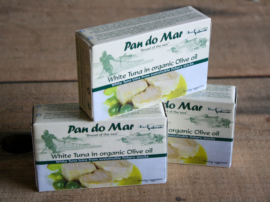 A cardboard box containing a tin of tuna