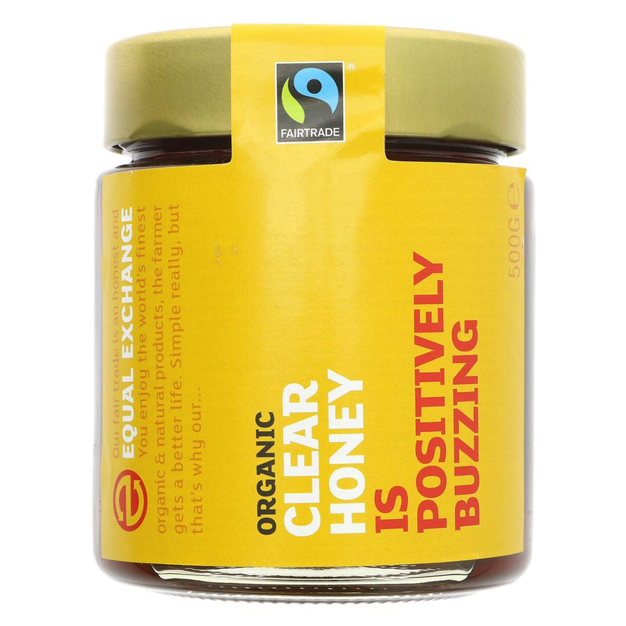A glass jar of honey with a metal lid