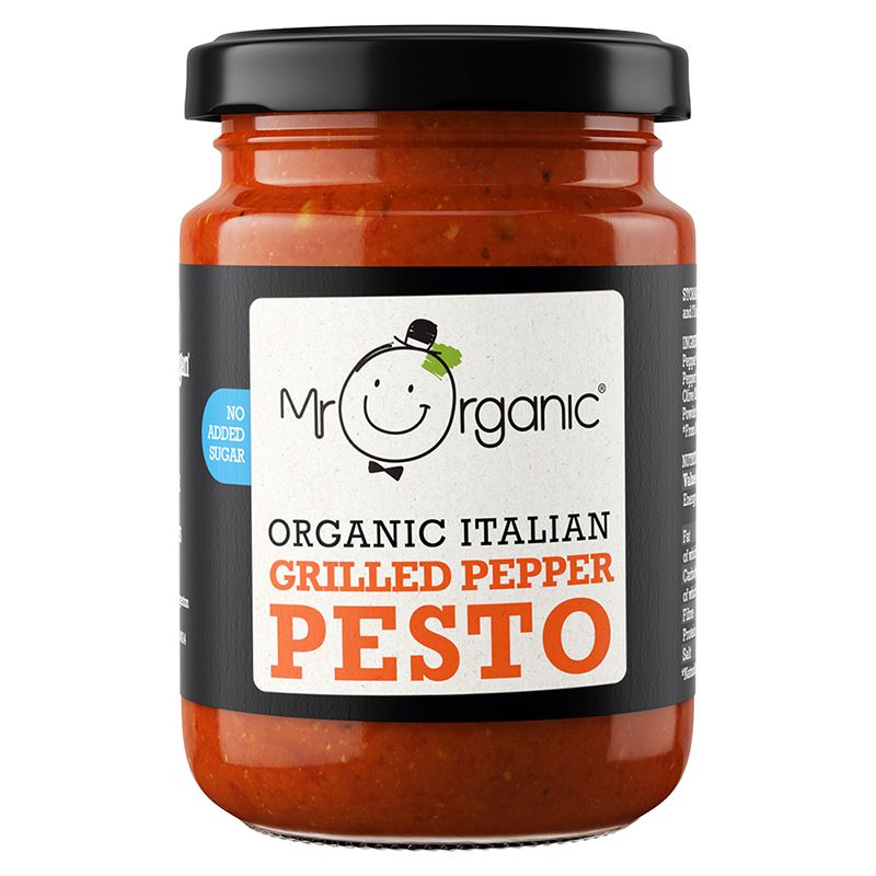 A glass jar with a metal lid of pesto