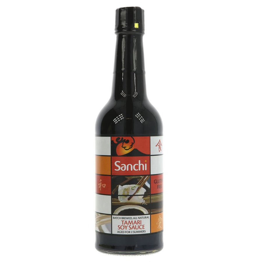 A glass bottle of tamari soy sauce with a plastic lid