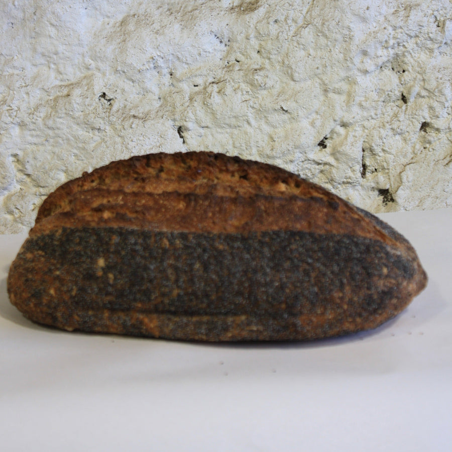 A loaf of seeded sourdough bread