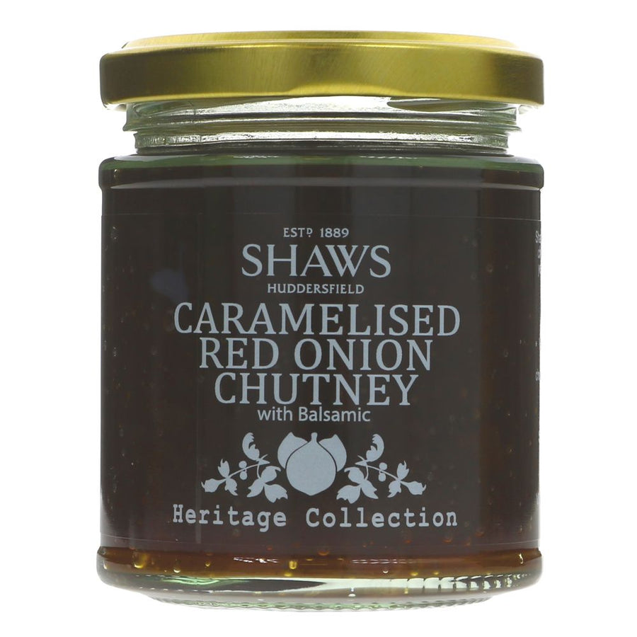 A glass jar of chutney with a gold metal lid and white writing