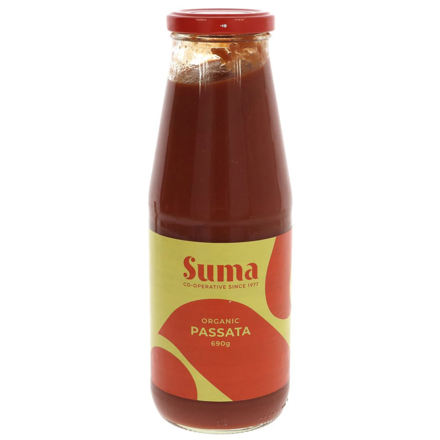 A tall glass jar of organic passata