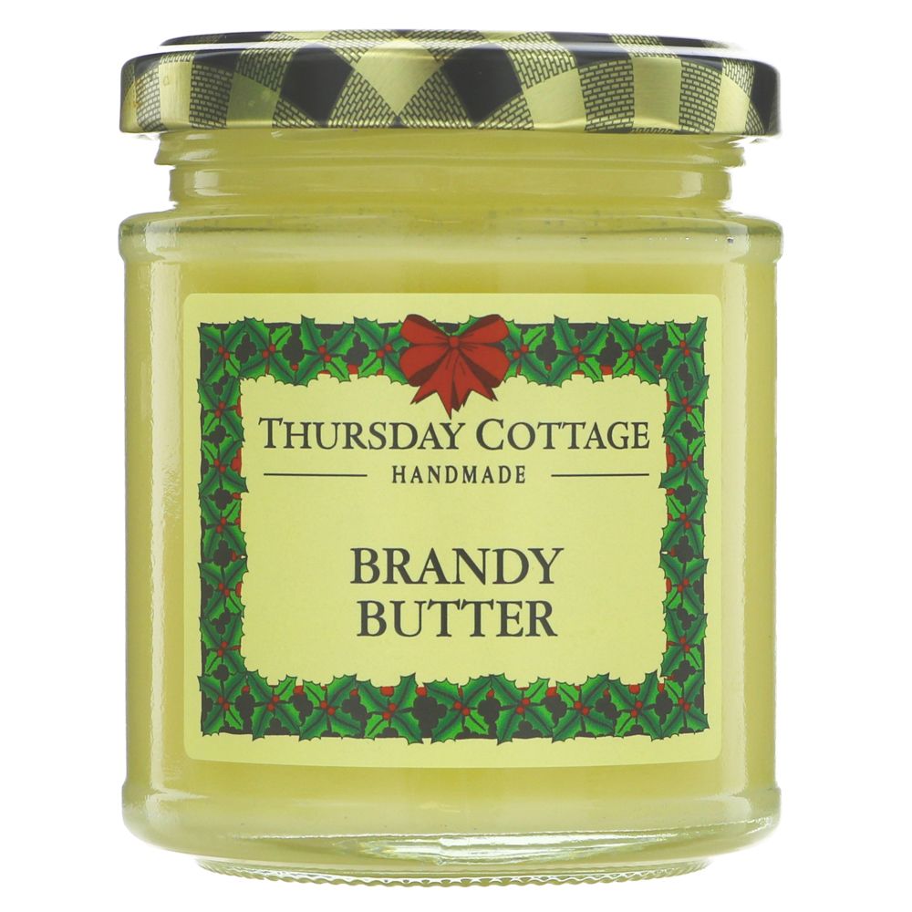 A small glass jar of yellow brandy butter