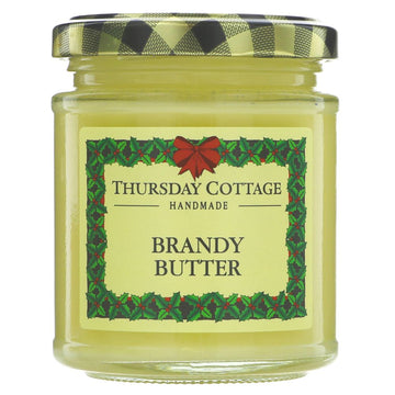 A small glass jar of yellow brandy butter